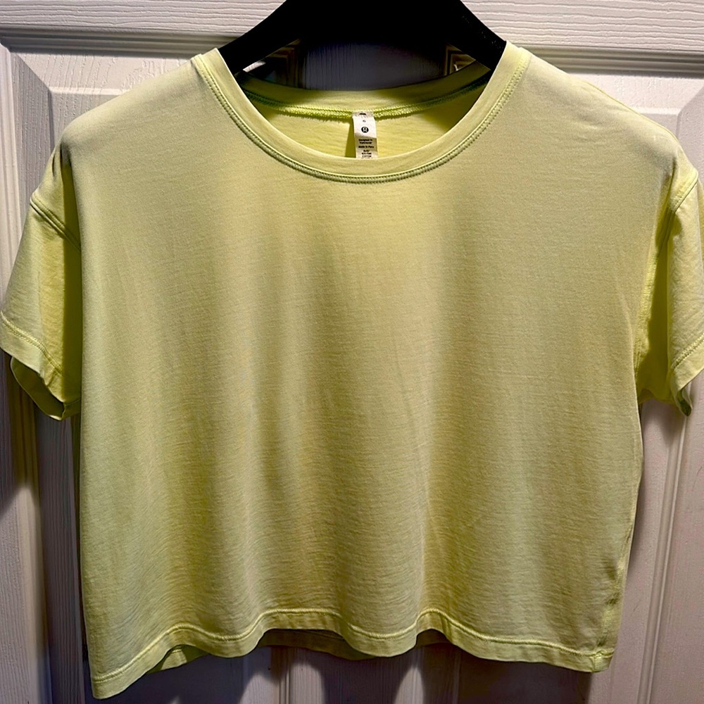 Lululemon Ultra light waist length TShirt lime green. Size 6